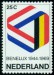 NIZOZEMÍ. symbol je tvořený vlajkami jednotlivých zemí Beneluxu
